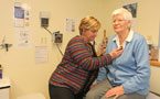 Dr. Jane Brooks, President of Doctors NS, examines a patient at her clinic in Middleton, Nova Scotia. 