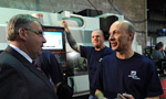 Premier Darrell Dexter chats with workers at Advance Precision in Dartmouth.