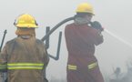 Firefighters battle a forest fire.