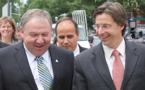 Premier Dexter (centre) shares a laugh with New Brunswick Premier Shawn Graham (right) at announcement. (CNB photo)